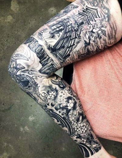 Black and grey ornamental full sleeve tattoo