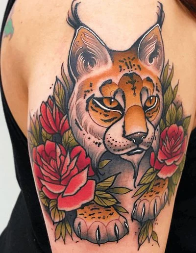 Colour neo-traditional lynx with red rose, shoulder tattoo