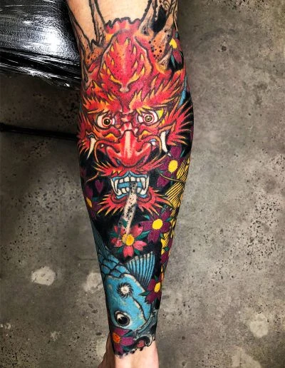 Red hannya demon colour lower-leg sleeve tattoo