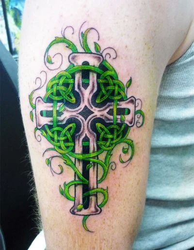 Green Celtic knotwork cross, upper arm tattoo